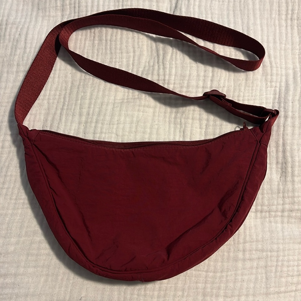 Burgundy Uniqlo crescent bag